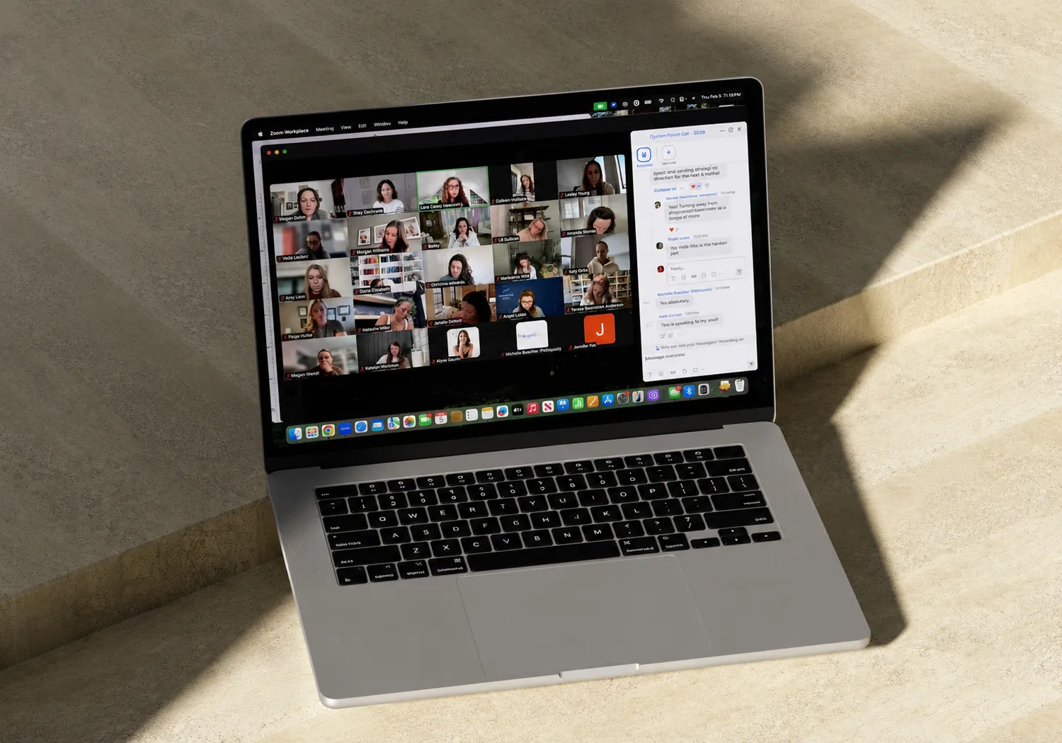 An Ilūme forum call in progress — a laptop showing a Zoom room of women members